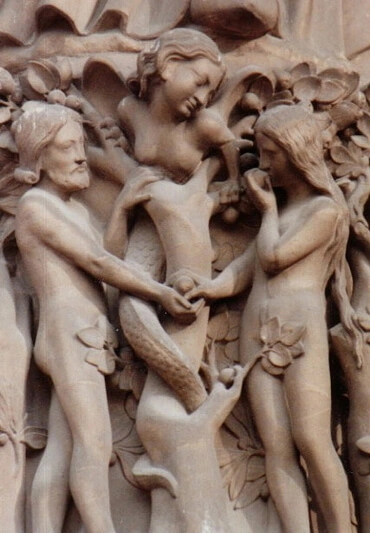 This relief, with a female serpent and Eve giving fruit to Adam, is at the entrance to Notre Dame Cathedral, Paris.