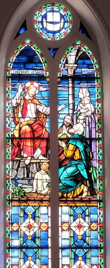 This stained glass window, at St. Matthew's Lutheran Church in Charleston, S.C., USA, shows the Word of God being shared with followers of Jesus.