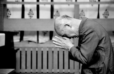 A man praying at a Japanese Shintō shrine, by Kalandrakas ([http://www.flickr.com/people/86251769@N00 カランドラカス]) from Kanagawa, Japan